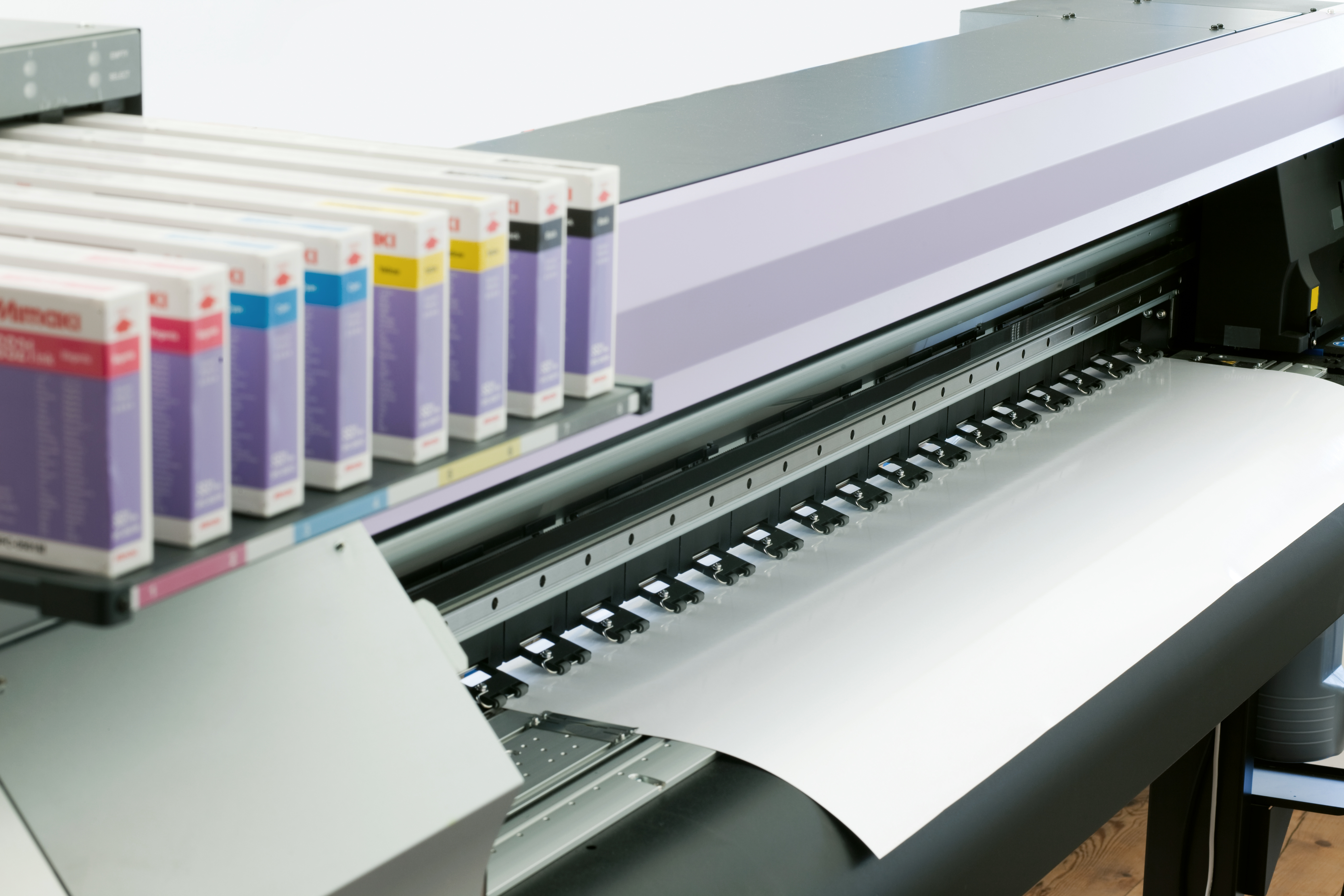 Wide-format printer producing a print sheet